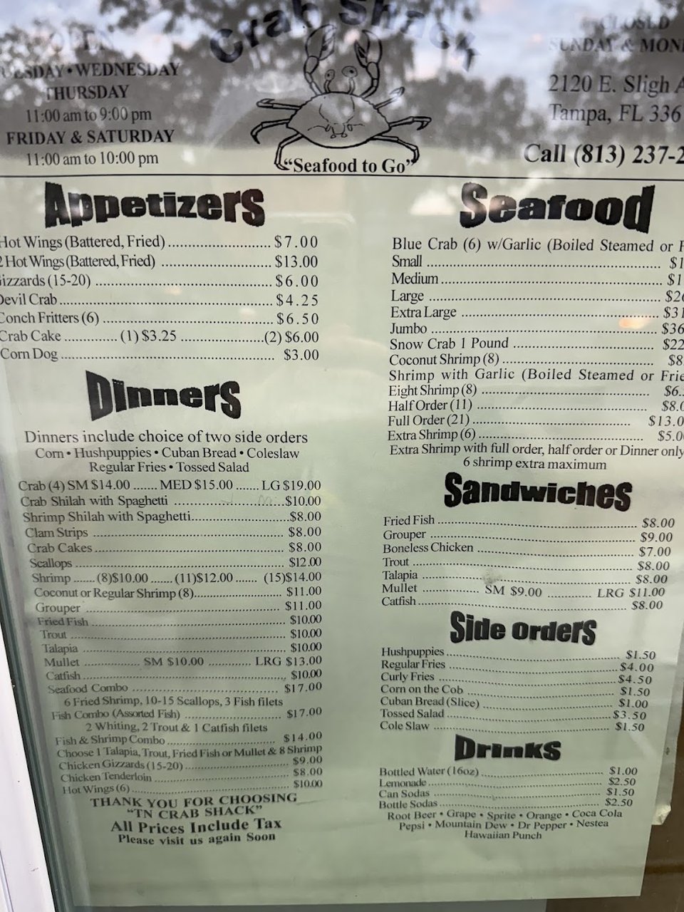 Menu board with crab, fish, and wing options.
